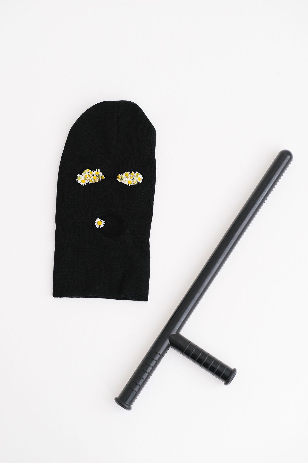 Expandable baton with holster
